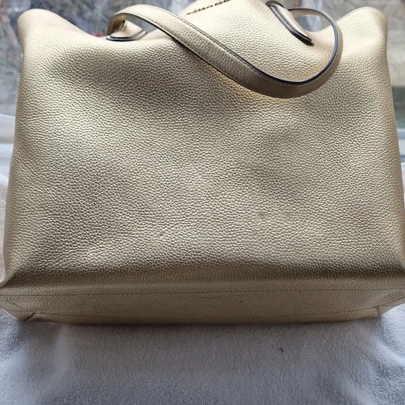 Michael Kors Shimmering  Gold Riversible Tote. - Picture 2 of 14